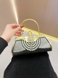 Elegant gold metal evening clutch bag with black fabric, pearls and rhinestones decoration
