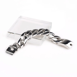 Macro shot of 32mm wide silver stainless steel Cuban link bracelet with box clasp