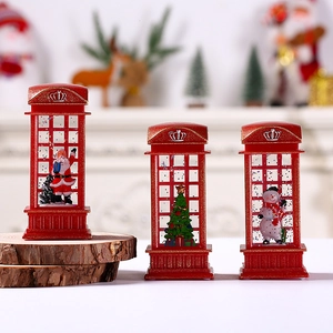 Close-up of red Christmas telephone booth lanterns with Santa, Snowman and tree scenes