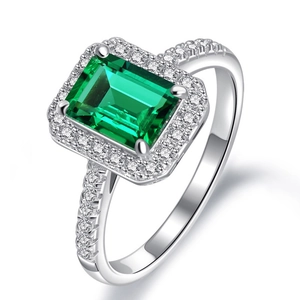 Classic silver ring with emerald cut green gemstone and small pavé diamonds