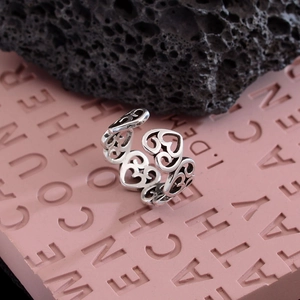 Retro punk style silver open ring featuring a hollow heart pattern for women