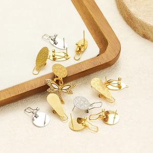 Golden and silver stainless steel teardrop earrings with dragonfly and textured patterns