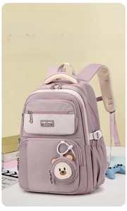 Macro view of water-resistant light purple school backpack with thick cushioned shoulder straps