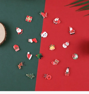 Macro view of various Christmas resin charms including Santa, elk, and trees for DIY crafts