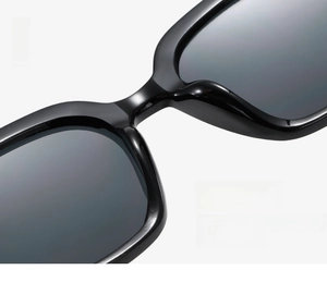 Close-up of comfortable integrated nose pads on black glossy sunglasses frame
