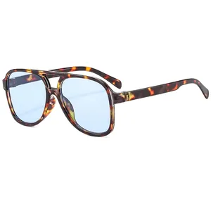 Tortoiseshell aviator sunglasses with light blue lenses and stylish double bridge frame
