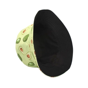 Detail view of reversible bucket hat with avocado print and plain black lining fabric