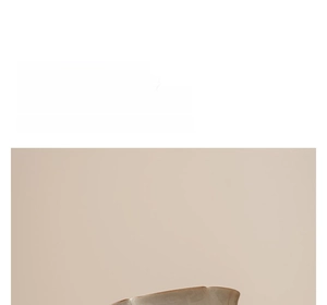 Macro shot of Dehua white porcelain tea cup with ash grey glaze and floral petal rim