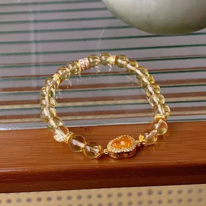 Luxuriöses Citrin-Perlenarmband mit herzförmigem Goldanhänger und funkelnden Zirkonen