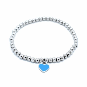 Detailed macro view of 4mm silver bead bracelet with blue enamel heart charm pendant