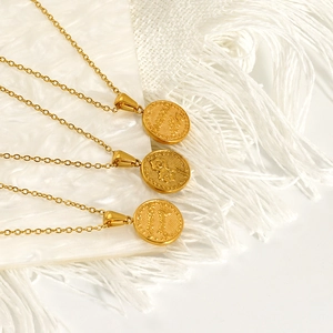 Three vintage embossed lily of the valley coin pendants on gold O-shaped link chains
