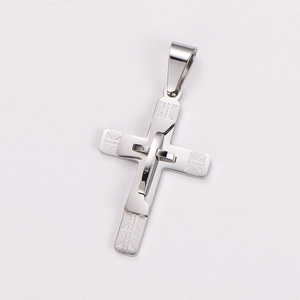 Detailed view of silver stainless steel triple layer cross pendant with geometric texture