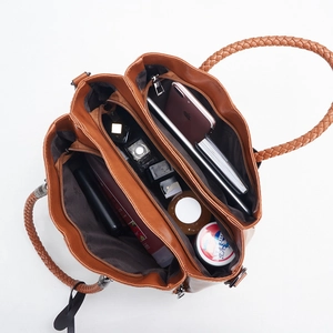 Top view of brown retro woven handbag showing spacious multi-layer interior and compartments