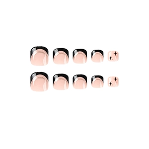 Black French toe nails with gold glitter lines and star patterns on pink base