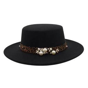 Close-up of black felt fedora featuring leopard print band with pearls and floral details