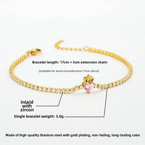 Detail of 17cm gold titanium steel tennis bracelet with pink heart cubic zirconia