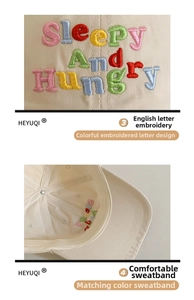 Detail showing the colorful Sleepy And Hungry embroidery and internal moisture-wicking sweatband