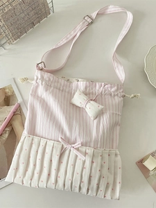 Pink striped bow tote bag with pleated heart pattern and adjustable shoulder strap