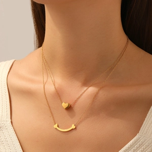 Collier double rang en acier inoxydable doré avec pendentif cœur et barre incurvée