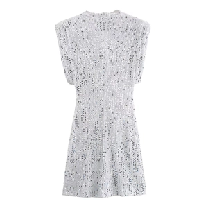 Detailed view of silver sequin fabric and texture on the slim fit sleeveless mini dress