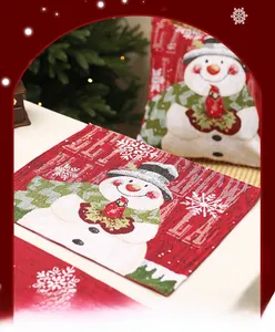 Close-up of festive Christmas placemat and pillow cover with snowman jacquard texture