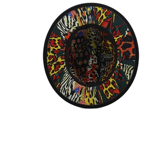 Detail view of the wide brim fedora featuring vibrant leopard and zebra print lining