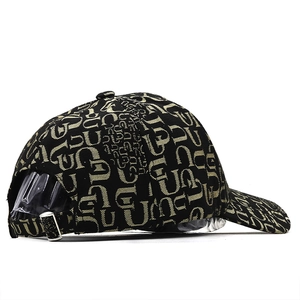 Black baseball cap with golden letter patterns and adjustable metal buckle on back