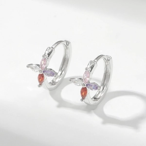 Detail view of silver hoop earrings featuring colorful marquise-cut floral zircon stones