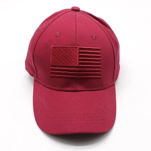Close-up of wine red baseball cap featuring detailed American flag embroidery on the front