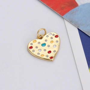 Close-up of heart pendant with colorful enamel and sparkling zircon inlay detail