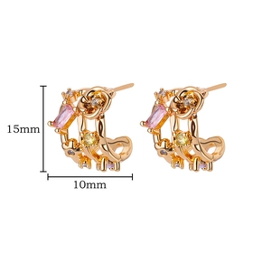 Detail view of gold earrings with pink rectangular gemstones and yellow zircons 15mm size
