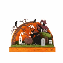 Detail of wooden Halloween silhouette lamp with witch, haunted house and Happy Halloween text