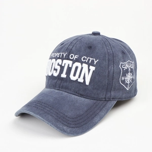Detail of vintage washed navy cotton baseball cap with white 3D embroidery and stitching