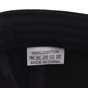 Detail view of the 100% cotton material tag and quality stitching on the baseball cap
