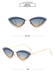 Macro view of cat-eye gold metal frame sunglasses with blue tea gradient lenses