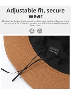 Detail view of khaki bucket hat showing black inner lining and adjustable strap