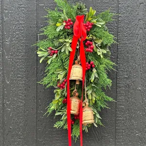 Christmas teardrop wreath with red berries, pine needles, and vintage gold bells decoration