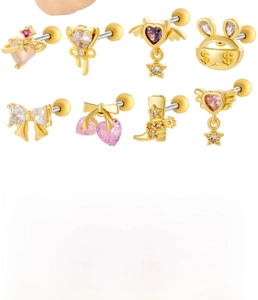 Macro detail of cubic zirconia cartilage studs with heart and bow designs on steel bars