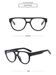 Detail of vintage double-bridge black frames with transparent lenses and non-slip temple tips