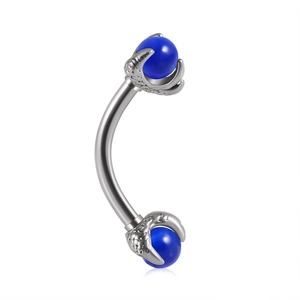 Detail of silver curved barbell featuring blue beads held by gothic dragon claw settings