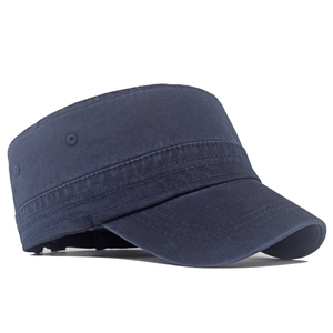 Detail of dark blue cotton cadet cap featuring side metal eyelets and reinforced stitching