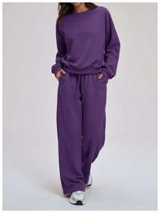 Detail of loose purple tracksuit showing comfortable cotton fabric and drawstring waist