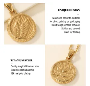 Macro shot of 18K gold plated titanium steel necklace with engraved wing pendant