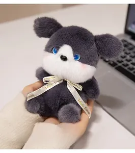 Close-up of fluffy husky plush toy with Woody friends ribbon and blue glass eyes