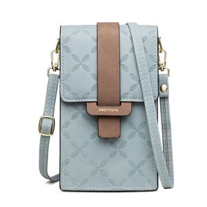 Detail of light blue PU leather phone bag with brown buckle and adjustable strap