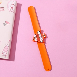 Detail shot of a kids orange silicone slap watch with a cute cartoon clownfish dial
