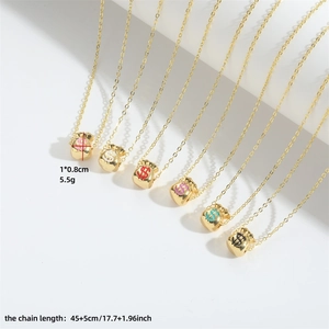 Golden money bag necklaces with colorful dollar sign pendants on a white background