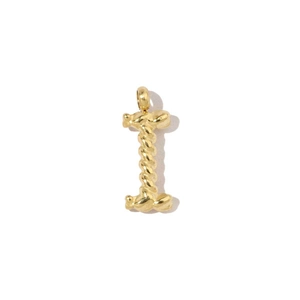 Macro shot of 18k gold plated letter I pendant with a twisted rope metal texture