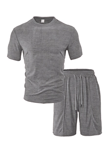 Detail of grey polo and drawstring shorts set featuring premium waffle texture fabric