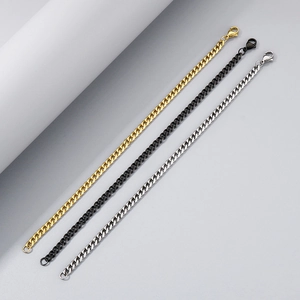 Three Cuban link bracelets in gold, black, and silver finishes with lobster clasps